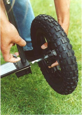 rear wheel - lift release handle on axle plate and pull wheel out